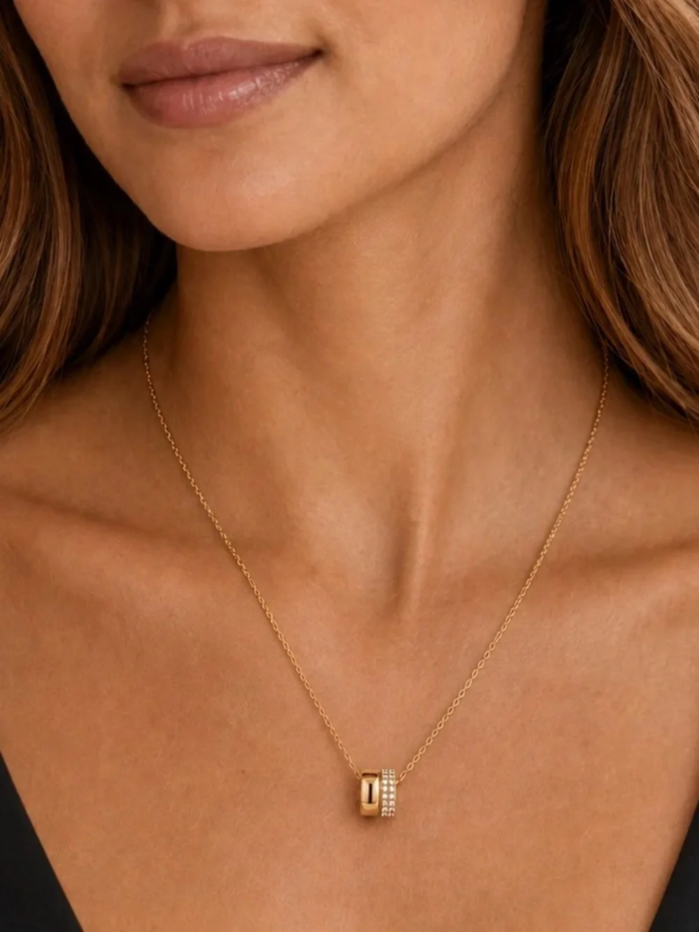 Elegant gold-tone pendant necklace featuring a pavé double ring design. NWT.